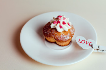 Beautiful coffee Cup with heart cupcake on white wooden background