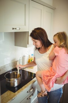 Mother and daughter cooking 