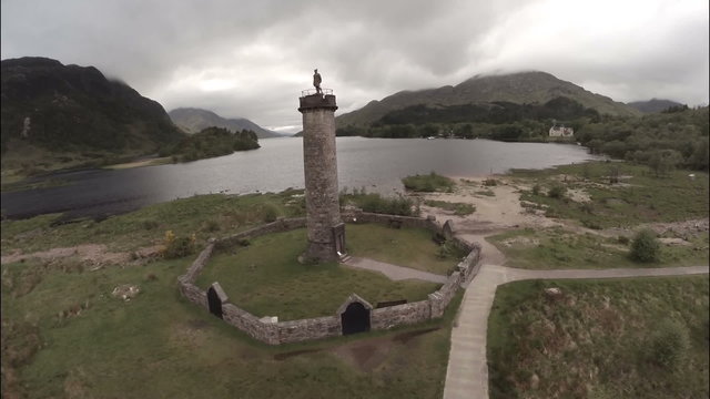 Aerial shot of the Glenfinnan Monument in the Scottish Highlands
