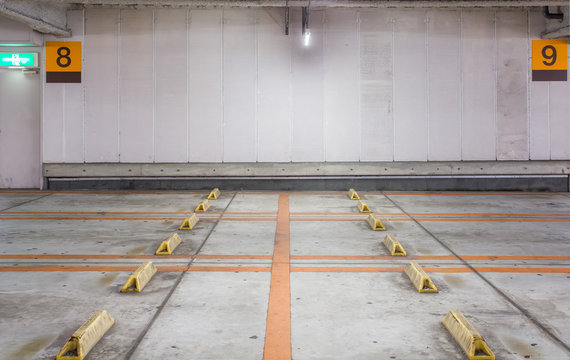 Empty space car park interior at night