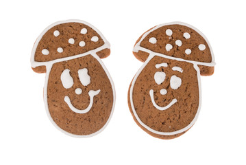 Two Christmas gingerbread mushrooms isolated on a white background