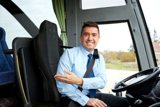 happy driver inviting on board of intercity bus