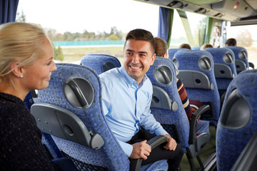 group of happy passengers in travel bus © Syda Productions