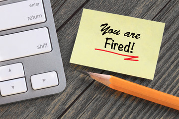 you are fired message on yellow note