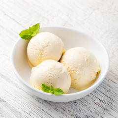 Fototapeta na wymiar Vanilla Ice Cream with Mint in bowl Homemade Organic product