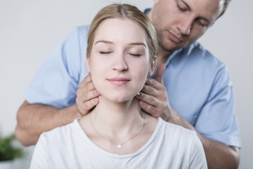 Fototapeta premium Woman havinh her neck massaged