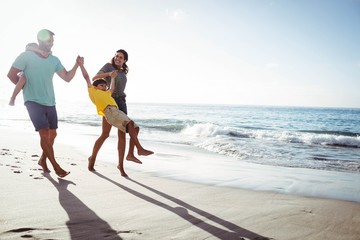 Cute family playing with their children