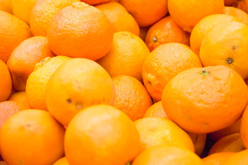 Pile of fresh oranges and mandarins