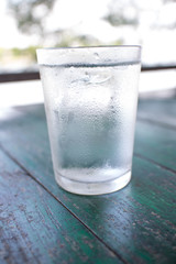 Water in glass on the table.