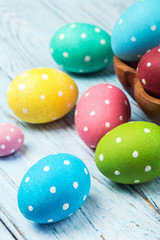 Obraz premium colored Easter eggs on wooden background