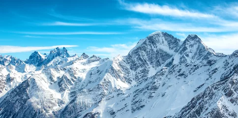 Foto op Canvas Panorama van witte bergen in de sneeuw © Pavlo Vakhrushev