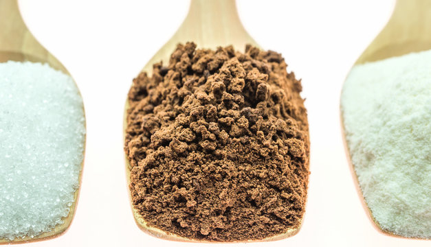 Coffee  and creamer and sugar on wooden spoon