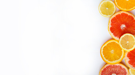 Citrus fruits. Oranges, grapefruits and lemons. Over white background with copy space