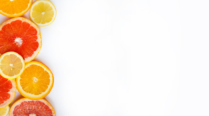 Citrus fruits. Oranges, grapefruits and lemons. Over white background with copy space