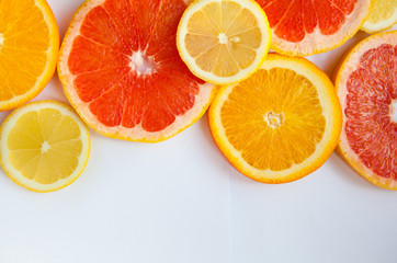 Citrus fruit background with a group of oranges lemons lime tangerines and grapefruit 