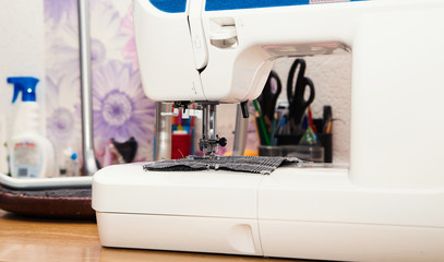 Detail of sewing machine and sewing accessories.