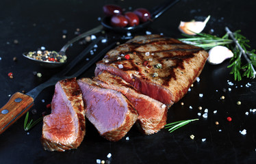 Grilled beef steak with spices, garlic and rosemary