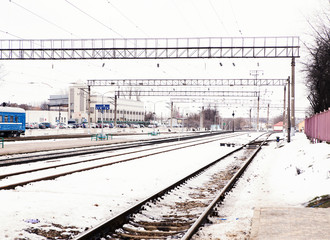 the image of a winter view of the railroad tracks