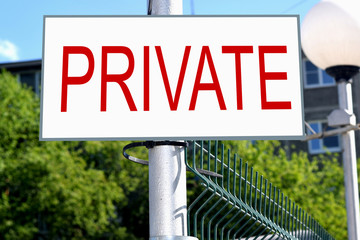 The sign "Private" on the fence of a private house