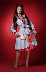 Portrait of a girl model in a beautiful dress and decoration.