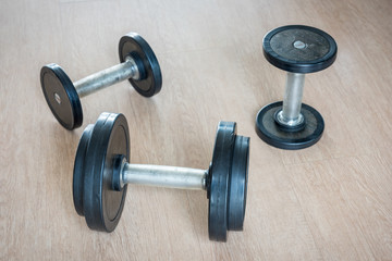 Naklejka na ściany i meble Sports dumbbells in modern sports club. Weight Training Equipment