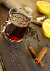 cup with spices on wooden table