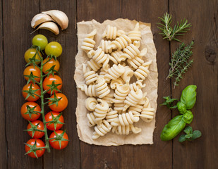 Italian pasta, tomatoes and  herbs