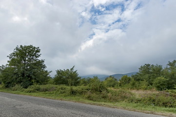 Fototapeta premium Picturesque road through Balkan mountain in cloudy day, Petrohan, Bulgaria 