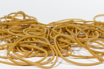 Heap of rubber bands on white