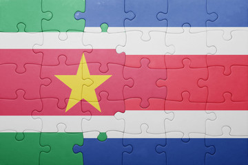 puzzle with the national flag of costa rica and suriname