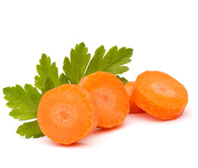 Chopped carrot slices and parsley herb leaves still life isolate