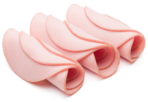 cooked boiled ham sausage or rolled bologna slices isolated on w