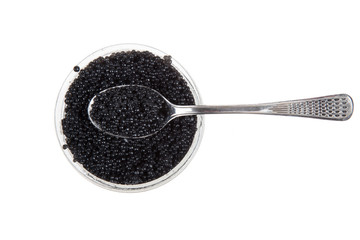 black caviar and spoon, isolated on white