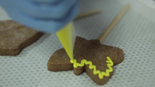 Cooking and decorating cookies with funy shapes.