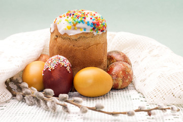 Easter cake with colored eggs and willow twig