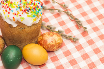 Top view on Easter cake with colored eggs