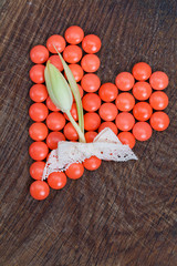 Heart of vitamins, vital heart for Valentines Day on wooden background.