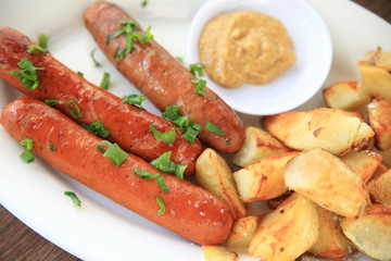 Sausages with home fries, mustard and chopped scallions