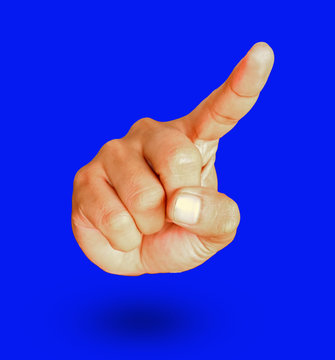 Male hand show gesture pointing something on blue background.