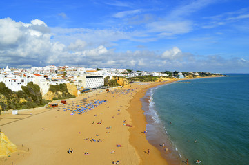 Albufeira, Algarve, Portugal - October 26, 2015 : People enjoying the sun on Albufeira Beach