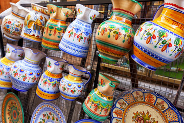 ceramic pitchers of sangria at a market in Toledo, Spain - obrazy, fototapety, plakaty