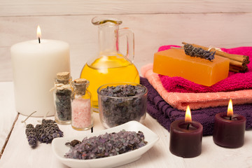 Lavender flower and bath salts spa, massage oil and big white candle