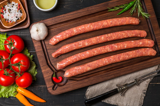 Raw sausage with spices and  vegetables