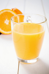 Orange Juice and orange fruit on white table
