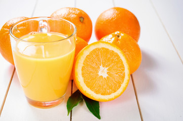 Orange Juice and orange fruit on white table