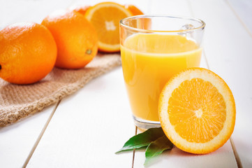 Orange Juice and orange fruit on white table