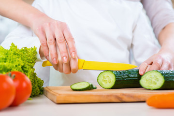 Mother and her daughter cooking 