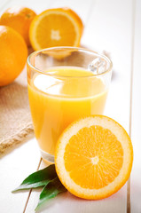 Naklejka na ściany i meble Orange Juice and orange fruit on white table