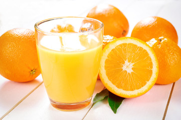 Orange Juice and orange fruit on white table