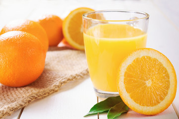 Orange Juice and orange fruit on white table